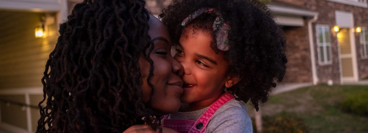 a picture of a woman holding her daughter 